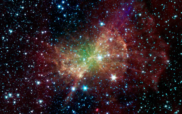 Infracrveni prikaz Dumbbell maglice s izraženim svjetlosnim efektima, snimljen NASA-inim Spitzer teleskopom.