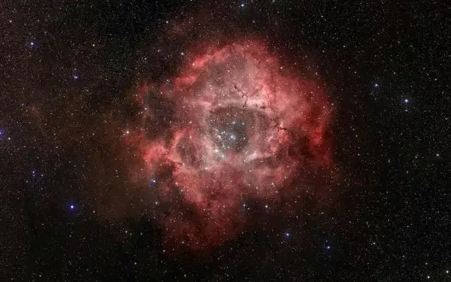 Turbulentna regija stvaranja zvijezda u Rosette maglici u toplim infracrvenim tonovima.